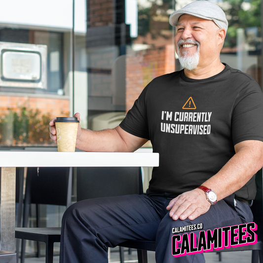 Smiling Man Wearing I'm Currently Unsupervised Warning Label Graphic Tee Funny T-Shirt