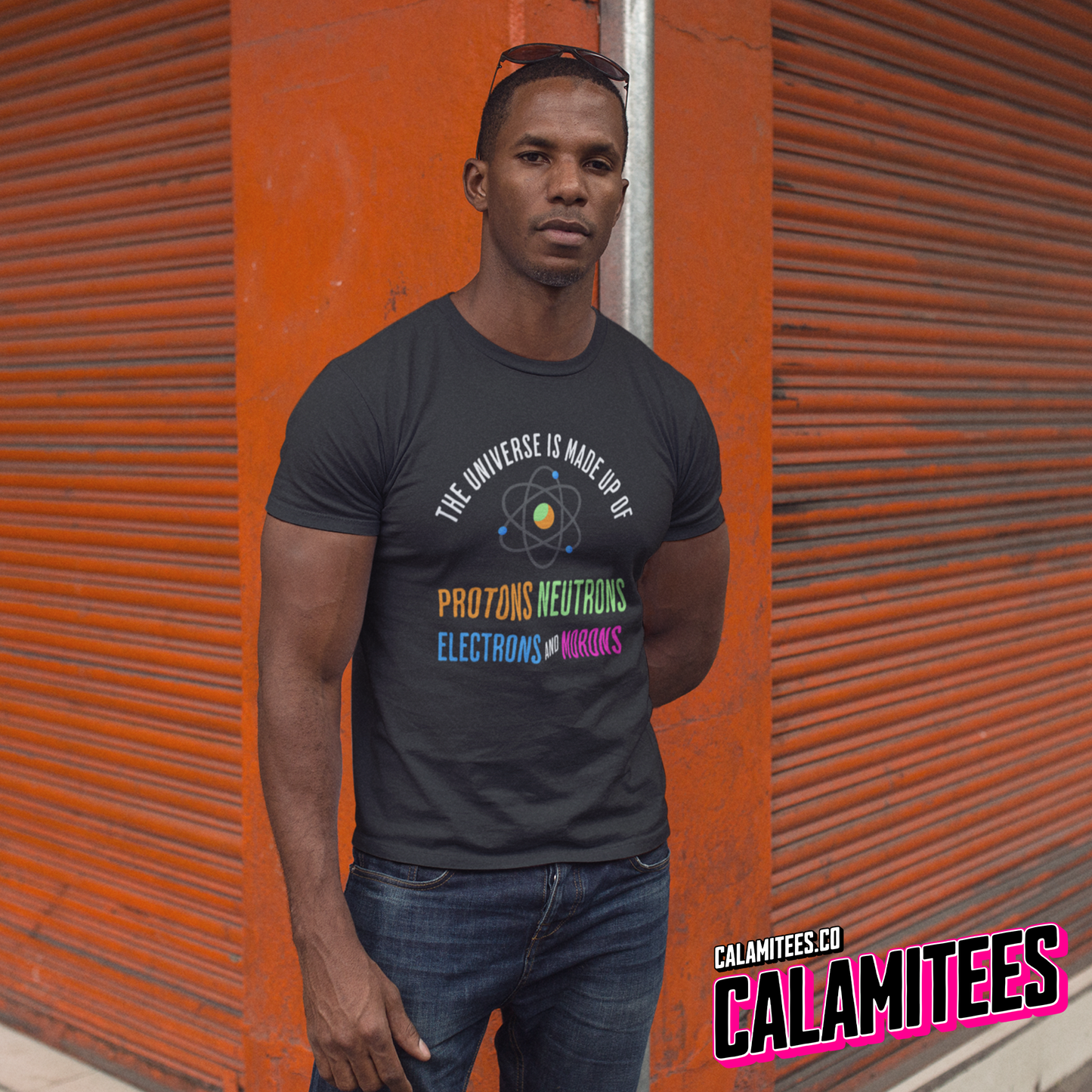 Muscular Young Man Wearing a The Universe Is Made Up of Protons Neutrons Electrons and Morons Graphic Tee T-Shirt