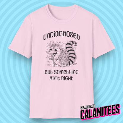 Undiagnosed But Something Ain't Right Funny Crazy Possum Opossum Raccoon Rodent Graphic Tee Sarcastic Humor T-Shirt CALAMITEES.co CalamiTees Shirt